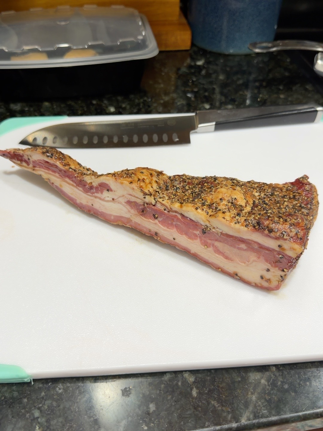 Pork belly on a cutting board during preparation